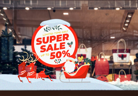 Oversized Christmas sale sign adhered to a storefront window for promotion
