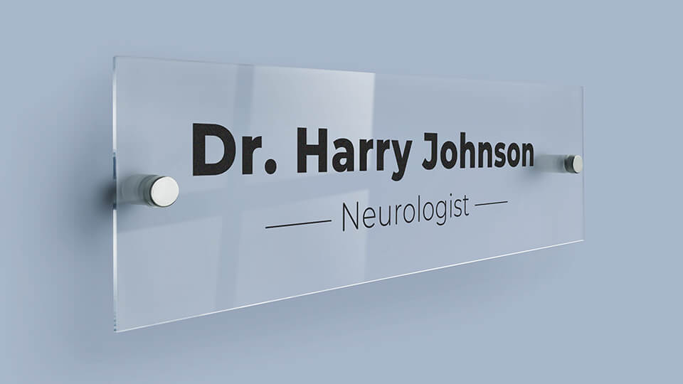 Acrylic name plate mounted onto the wall with standoffs
