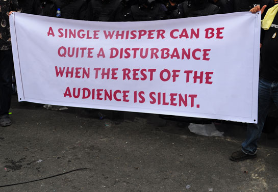 huge protest poster idea on a white banner