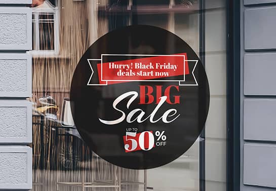 Big round-shaped Black Friday sale sign adhered to the store windows