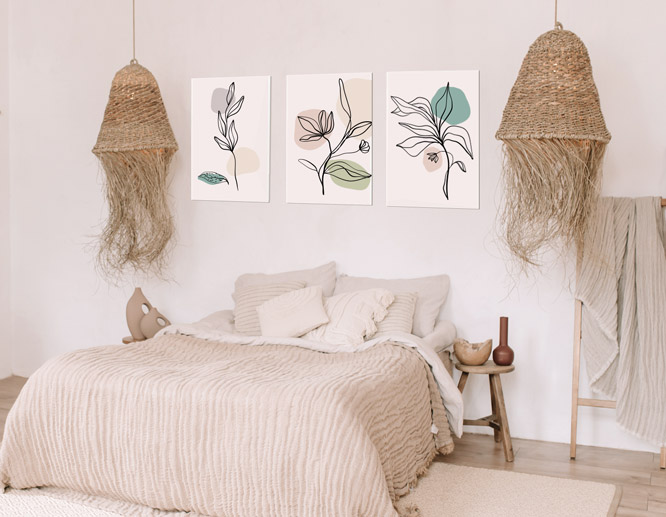 three pieces of modern bedroom wall art with botanical line drawings