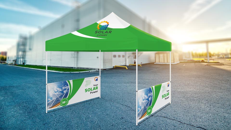 Tent half walls showcasing solar power company name and logo on the sides of a canopy tent