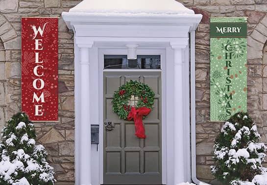 Outdoor Christmas porch welcome banners with a decorative wreath