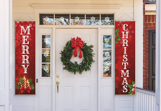 Christmas welcome signs hanging on both sides of a door made of banner material