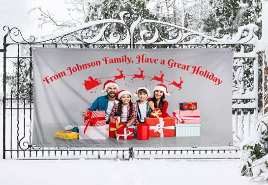 Johnson family custom banner attached on the fence with family portrait and Christmas decorations