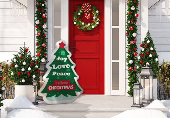 Custom-designed Christmas porch sign placed next to the main door