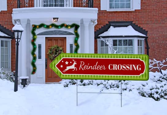 Directional Christmas sign with colorful thematic graphics
