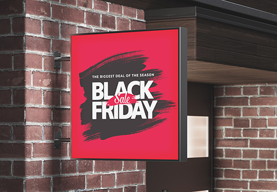 Black Friday dazzling sale sign in red and black placed on the store wall