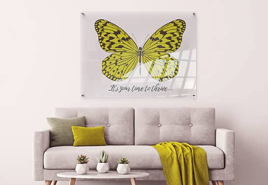 Living room decor item with a bright yellow butterfly and an inspirational note
