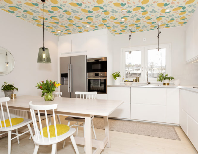 vibrant modern kitchen wall art with lemon icons featured on the ceiling