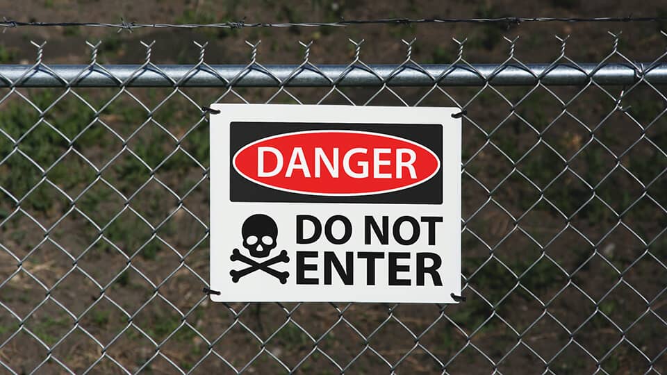 Outdoor aluminum sign with a caution note