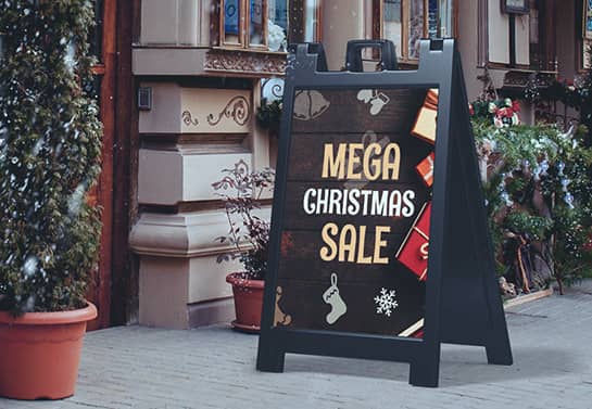 Christmas mega sale sign placed on the storefront