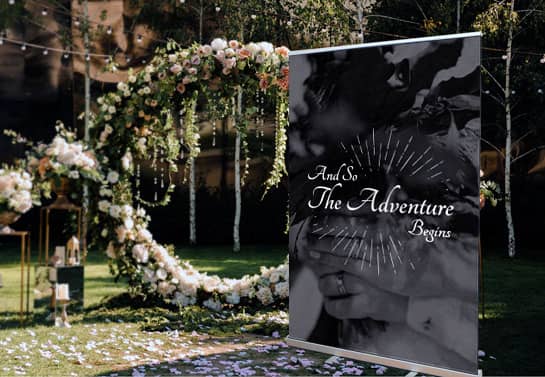 black outdoor wedding party banner idea with a quote