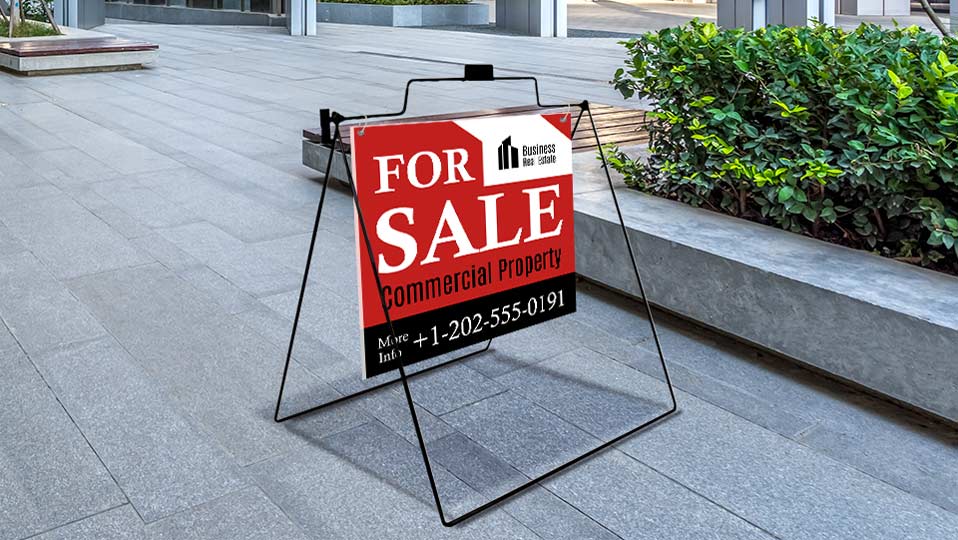 Real estate A-frame sign for sale with contact information