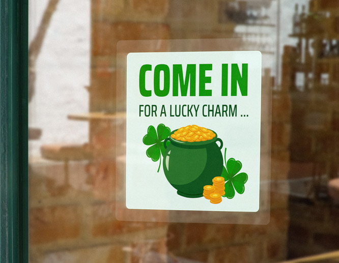 Promotional St Patrick's Day window cling with a pot of gold and a shamrock at the storefront