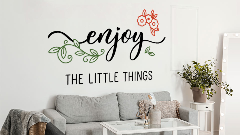 Decorative vinyl lettering showcasing a quote attached to the wall behind the sofa