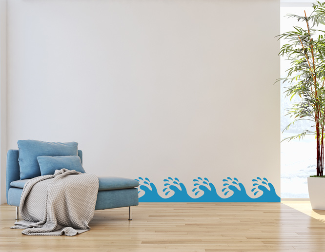 A living room wall decal idea portraying beach waves at the bottom of the wall