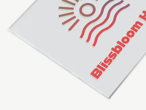 Close-up of an acrylic sign showing part of a hotel logo and name for hospitality use.