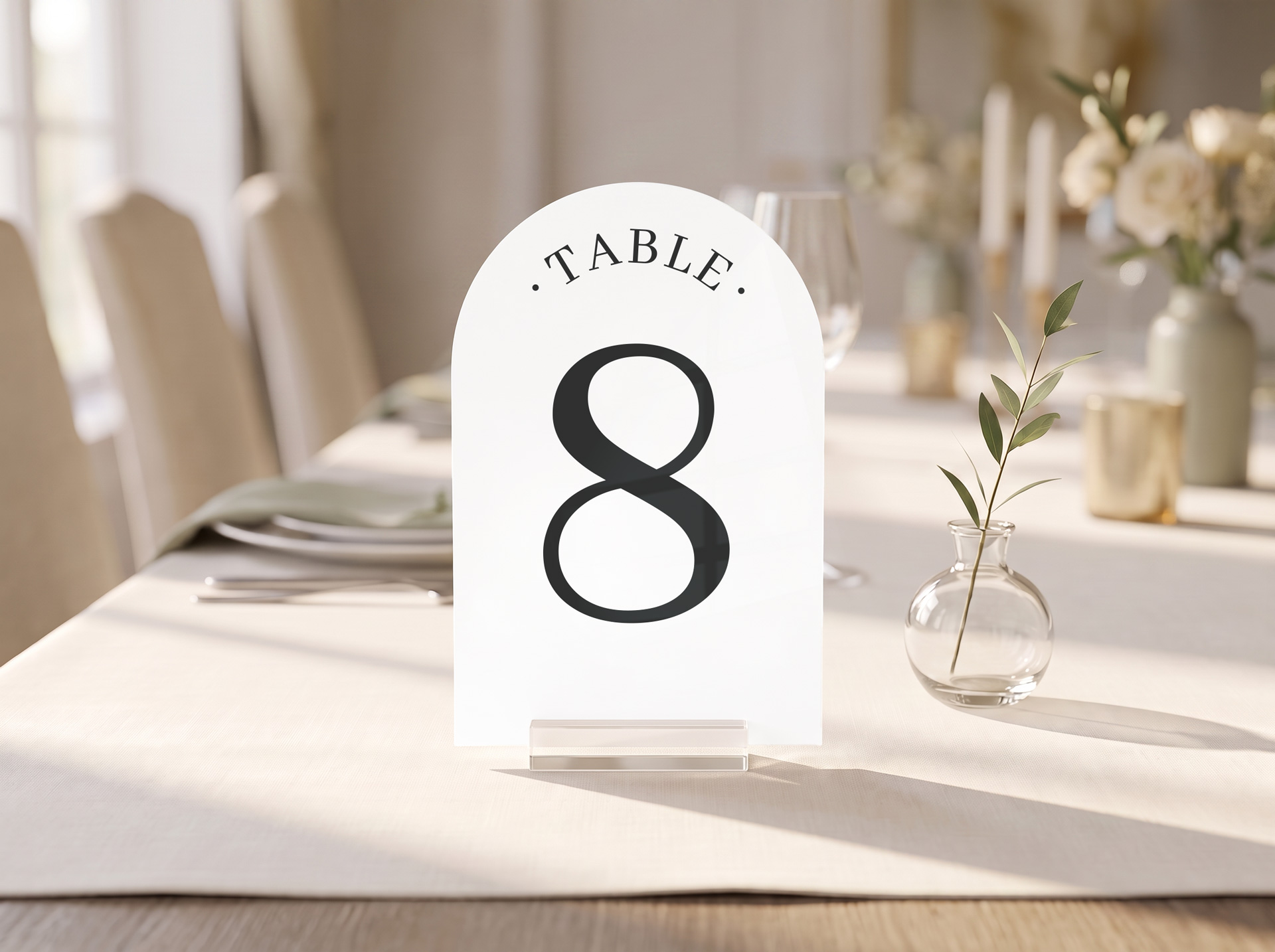 Arch-shaped white acrylic table number on a wedding reception tablescape