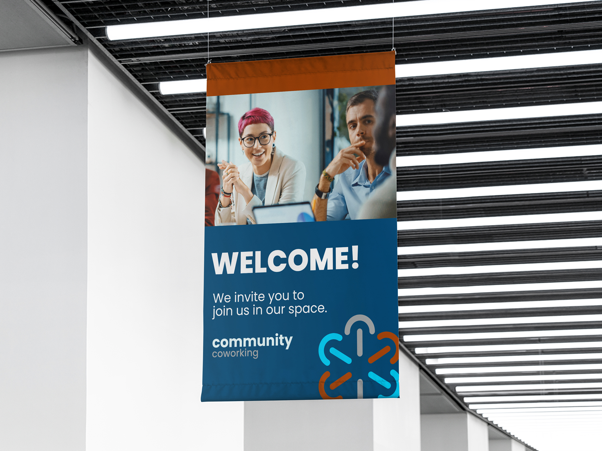 A hanging custom banner advertising a coworking space.
