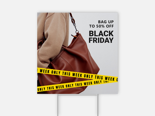 Black Friday yard sign showing brown leather bag with yellow caution tape.