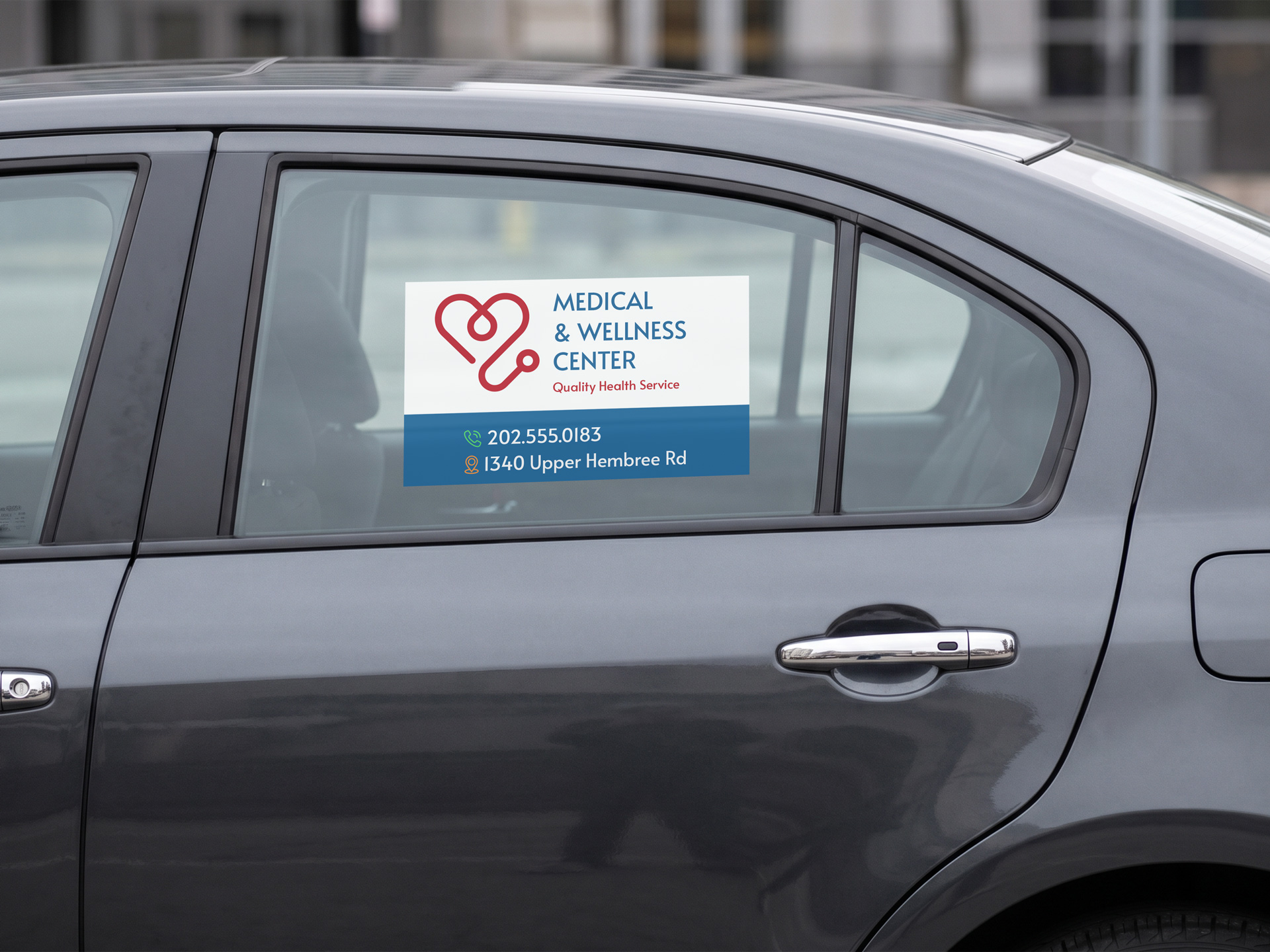 Magnetic cling applied to a car side window with business advertising