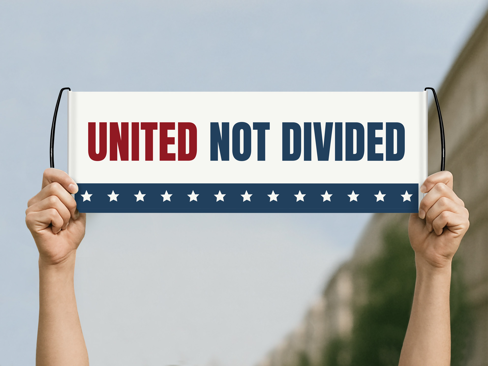 personalizes handheld banner featuring "United not divided" messaging