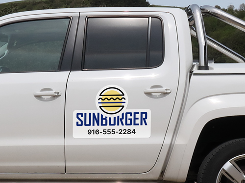 Branding car logo magnet applied on the side door of the truck reading the brand name and number.