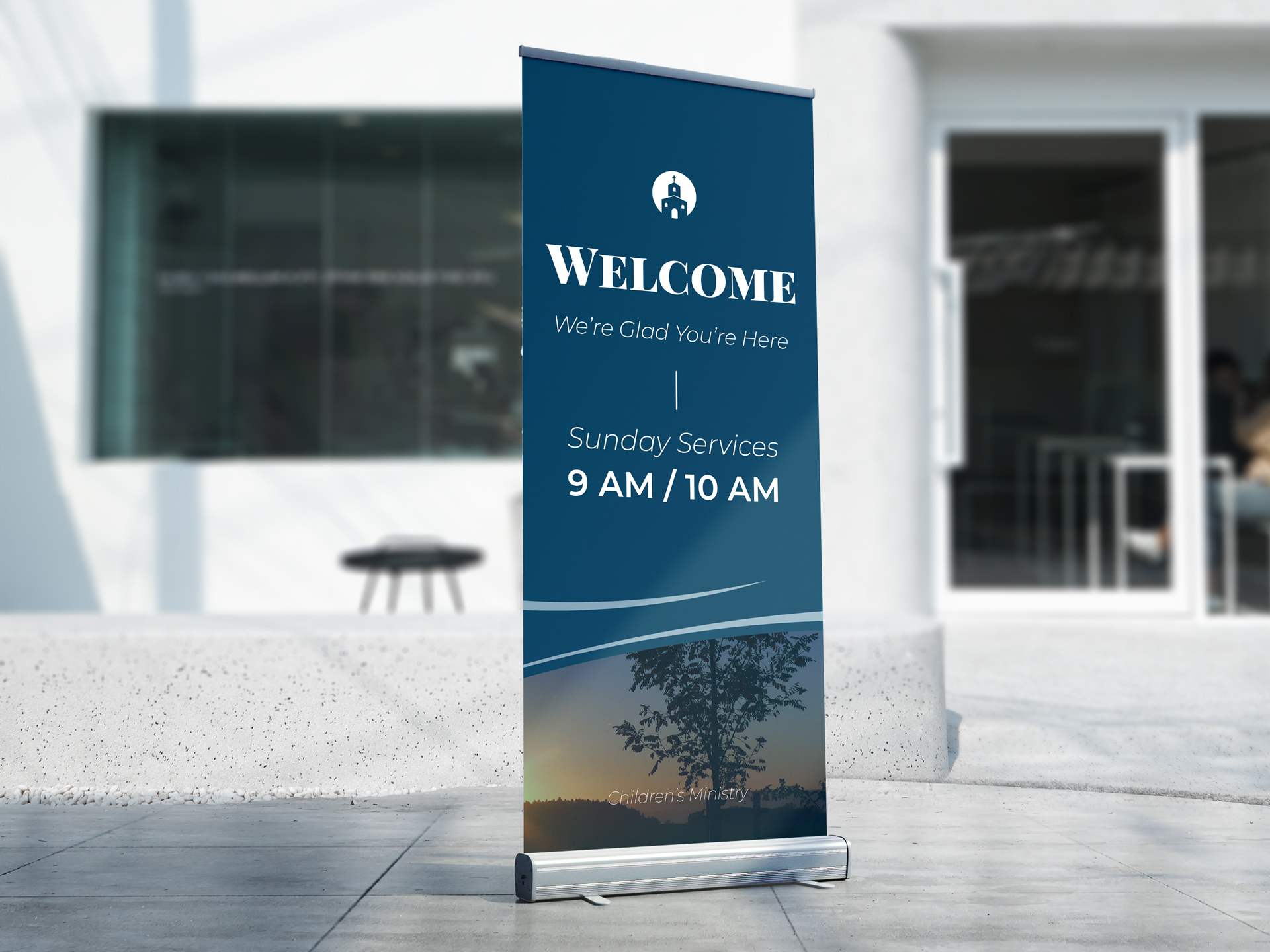 A retractable banner sign welcoming community members to a church's Sunday service.