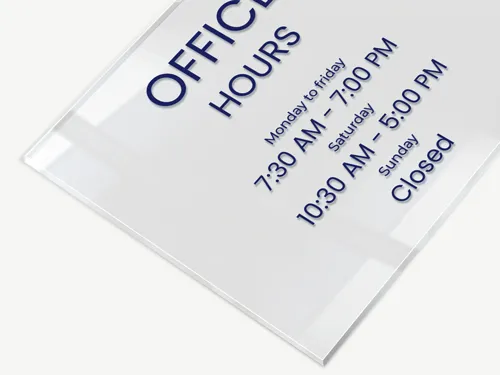 Clear acrylic sign for an office featuring business hours