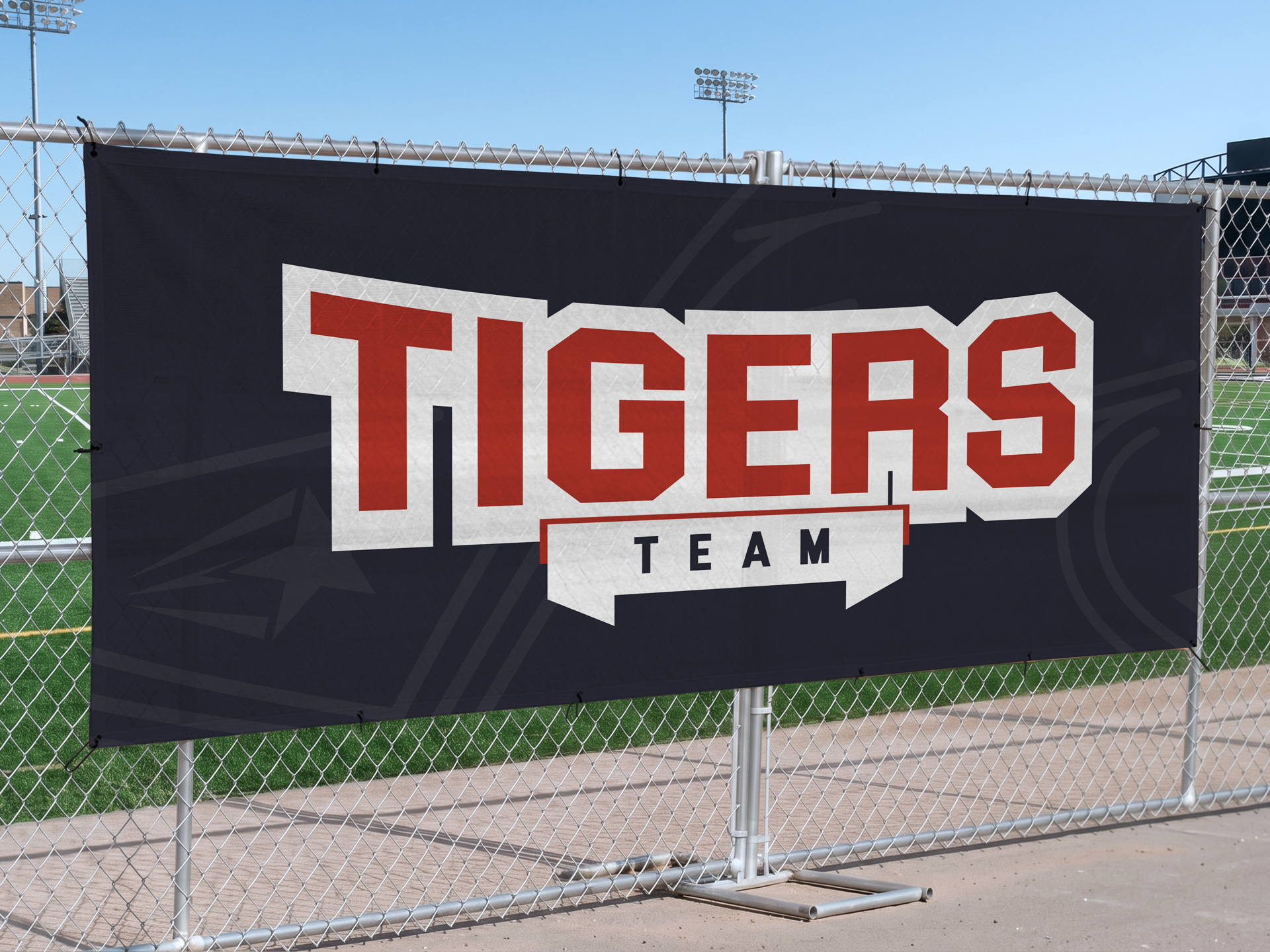 Tigers Team soccer banner displayed on a stadium fence for club branding.