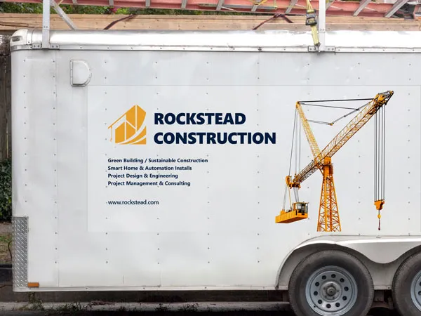 A custom trailer decal highlighting the services offered by a construction company.
