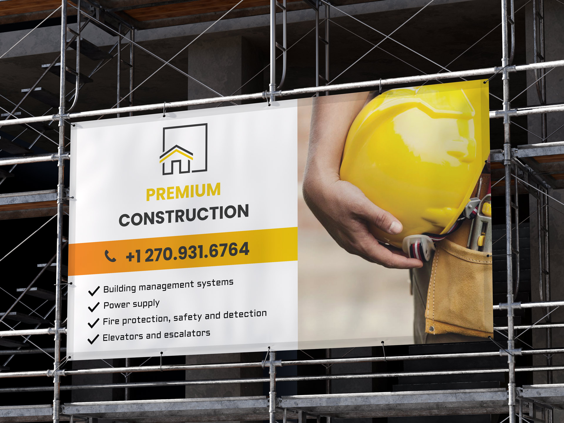 A mesh banner placed on scaffolding around a construction site with the company branding and its services.