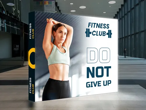 A striking SEG backlit popup display for a Fitness Club with an inspirational message.