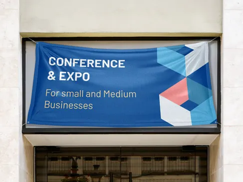 Custom banner for business conference and expo installed above a building's entrance