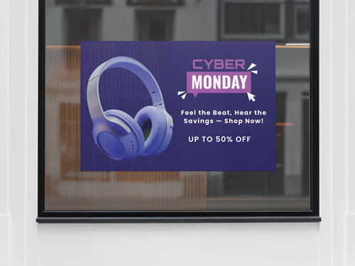 A Cyber Monday window decal with purple headphones, Feel the Beat tagline, up to 50% off sale.