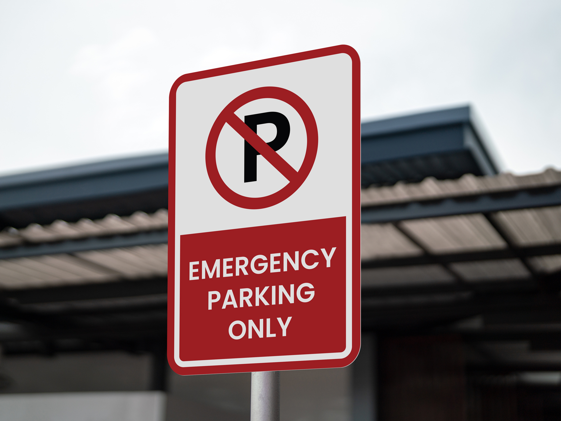 Emergency parking only sign restricting spaces for hospital emergency vehicles.