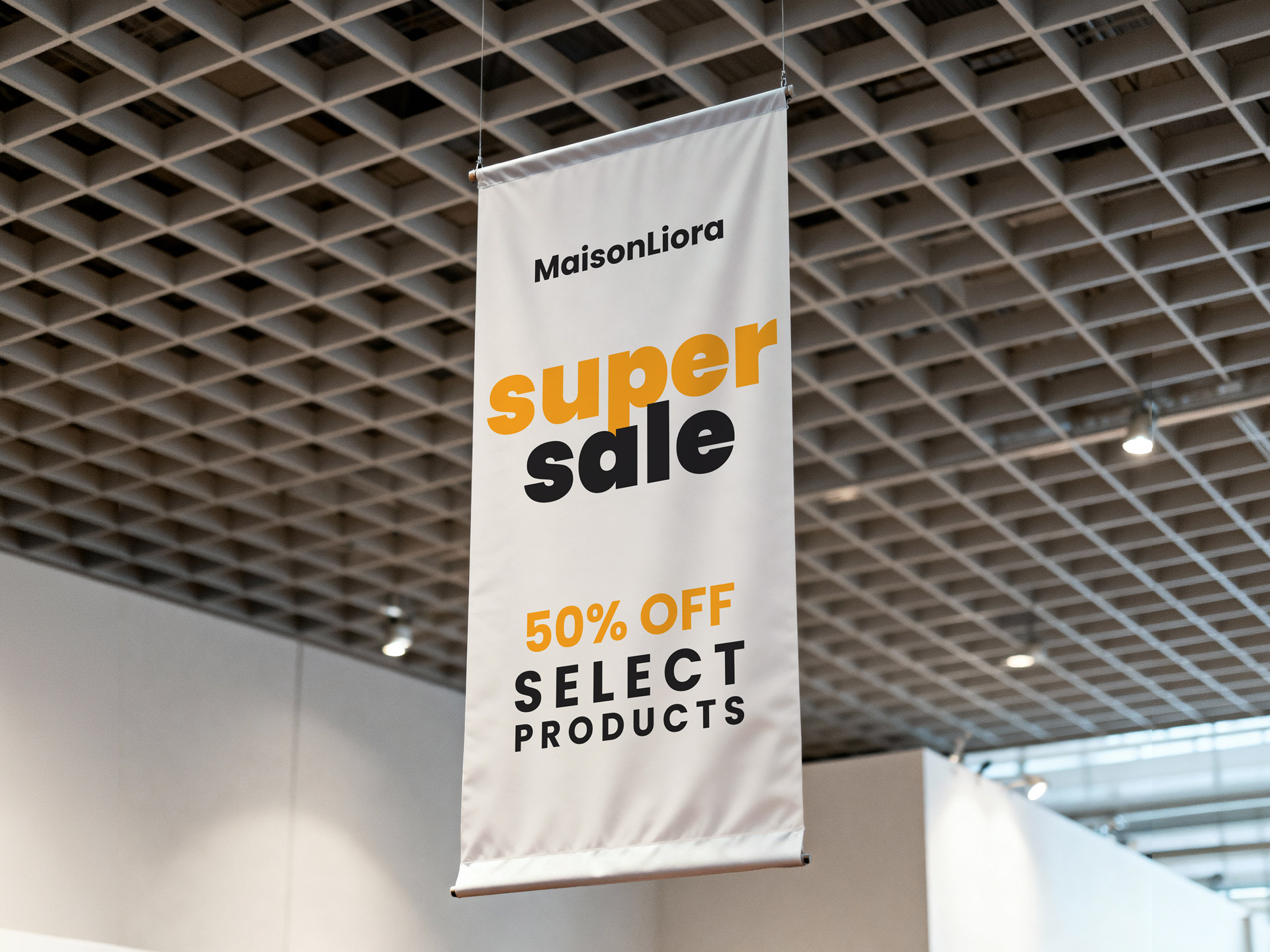 A white hanging fabric banner with a sale promotional message