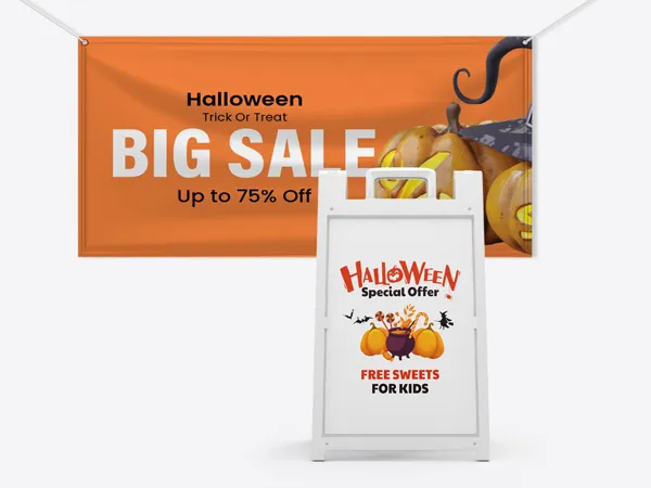 Custom Halloween signs printed on a hanging banner and a sandwich board.