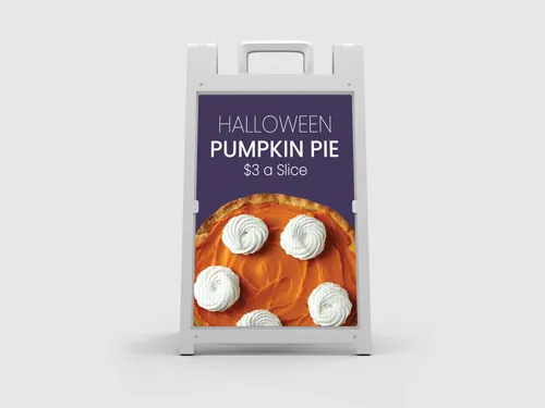 A Halloween Pumpkin Pie sandwich board with delicious pie visuals.