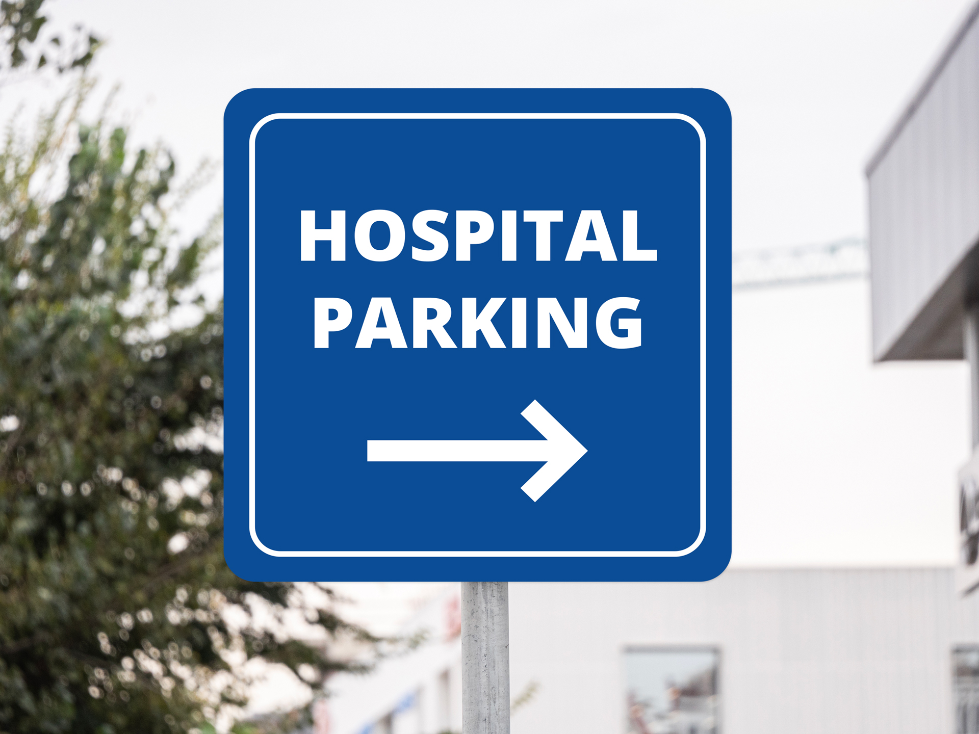 Hospital parking directional sign with arrow guiding visitors to parking area