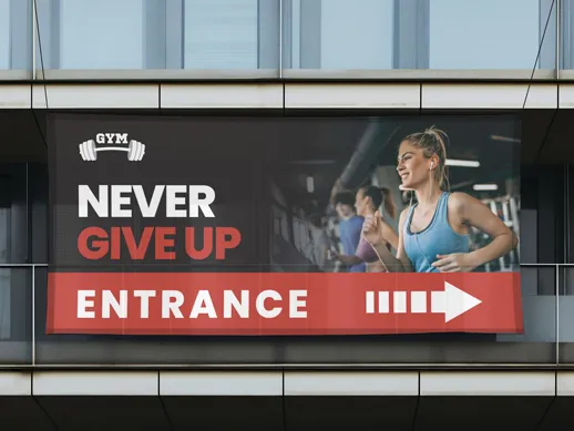 business banner advertisement that indicates the entrace of a gym with inspirational text