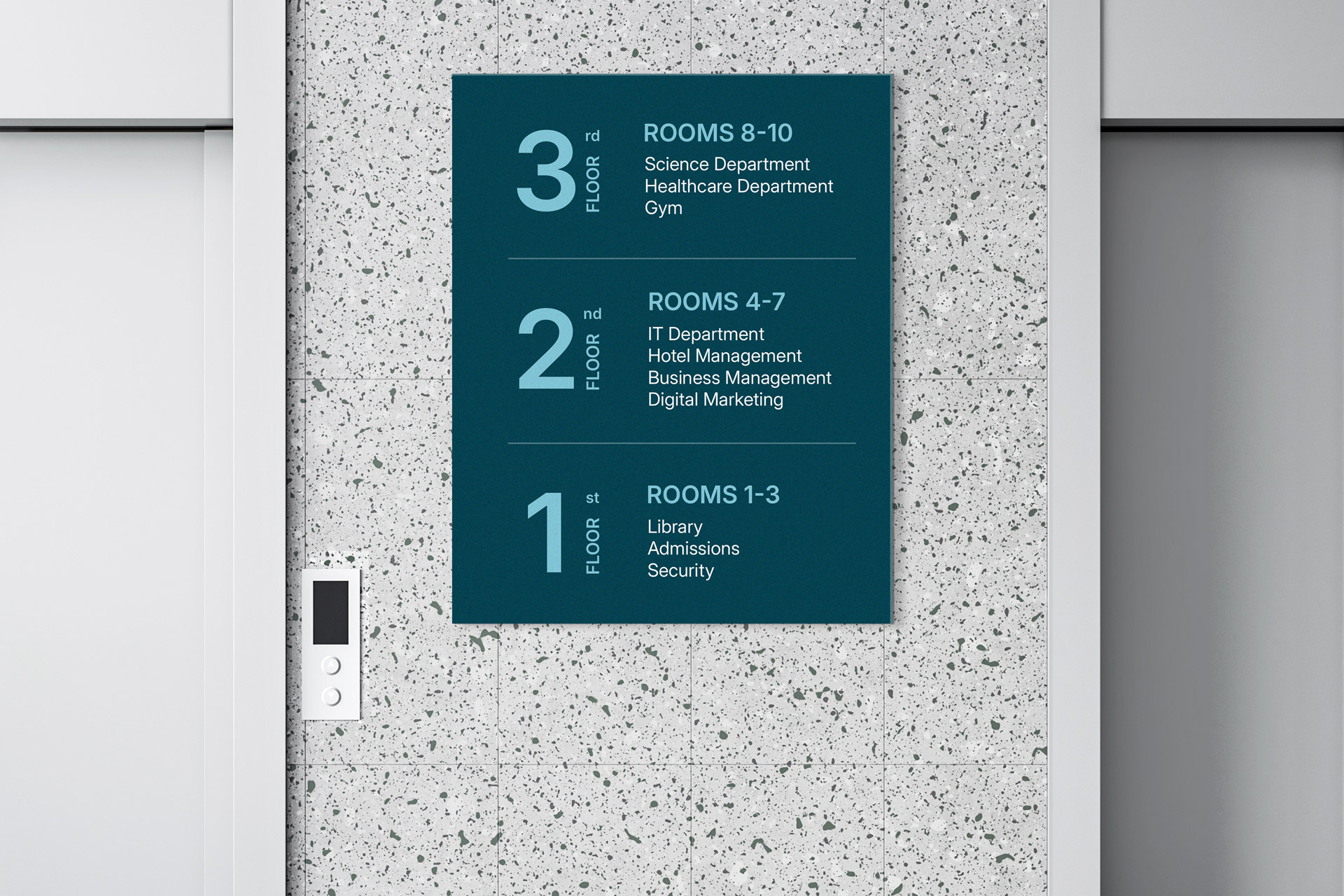 Interior wayfinding sign mounted next to the elevator displays the departments across three floors