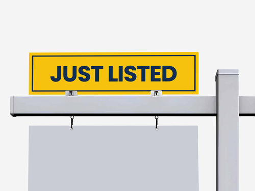 Just Listed Real Estate Rider Sign set against a yellow background