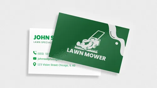 Lawn service business cards featuring a lawn mower and contact info in green and white