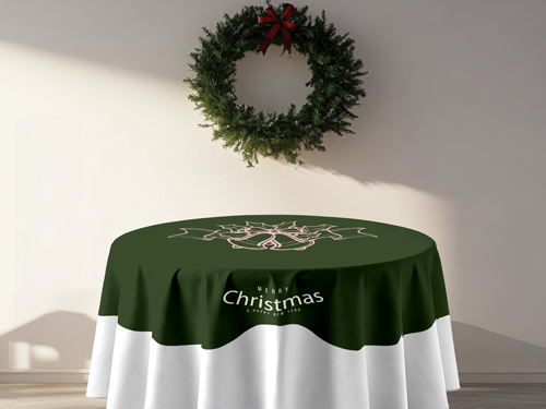 Round Christmas table cover with green holiday design and “Merry Christmas” text displayed under a festive wreath.