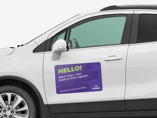 A car magnet attached to the front drivers door of a crossover promoting a newly established company.