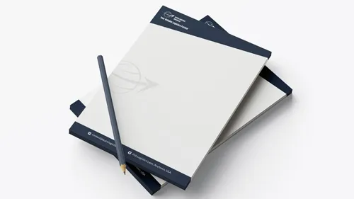 Notepad printing in navy-and-white with a minimalist logo and contact details at the top and bottom