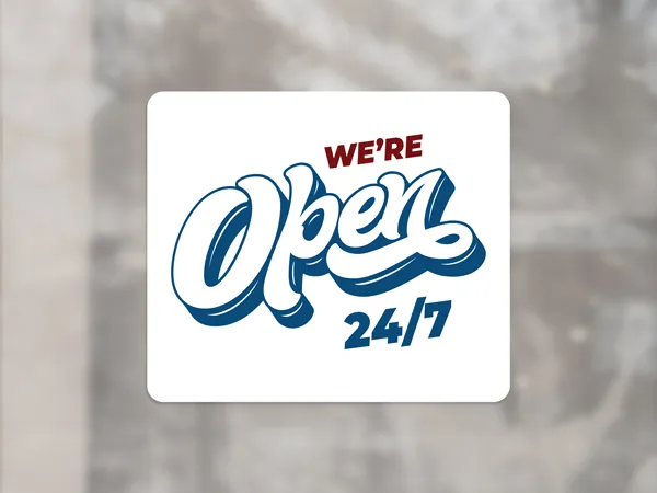 A white window cling with blue and red text and figures showcasing a shop's opening time.