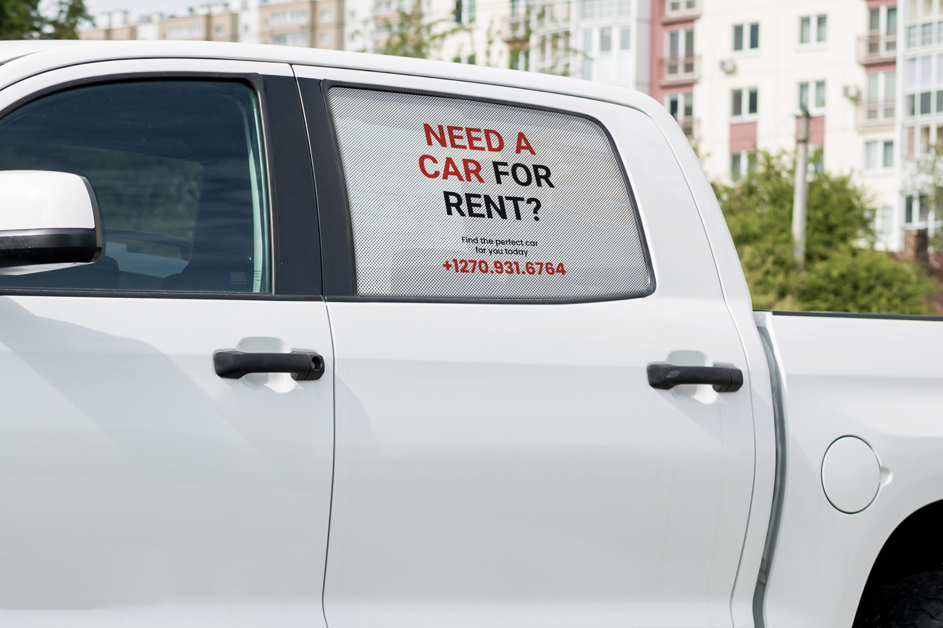 Custom perforated decals installed on the side window of a car.